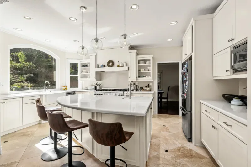 Professionally refinished white kitchen cabinetry